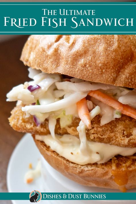 If you’re looking for the perfect fried fish sandwich that combines crispy, golden fried fish with tangy homemade tartar sauce and crunchy coleslaw, this recipe is exactly what you need. Using my crispy beer-battered fish, homemade tartar sauce, and fresh coleslaw, this sandwich is a crowd-pleaser. Whether it’s for a casual lunch or dinner, this easy-to-make sandwich is sure to become a favorite in your household! Sauce For Fish Sandwich, Grouper Sandwich Recipes, Fried Fish Sandwich Recipes, Fried Cod Sandwich, Fish Sandwich Sauce, Fish Burger Recipe, Fresh Coleslaw, Fried Fish Sandwich, Crunchy Coleslaw