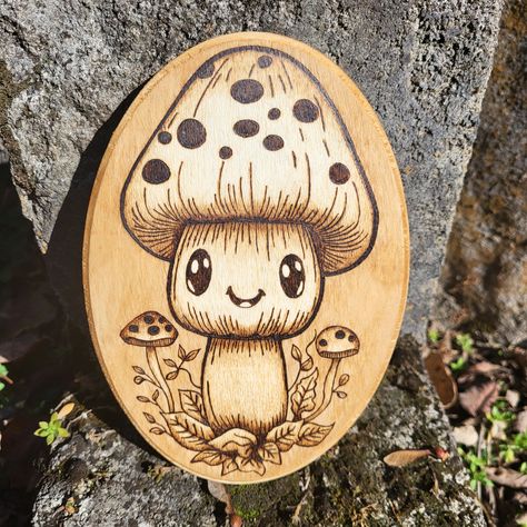 Note: Made to order. Design and shading may vary slightly! Please allow me up to a week to complete piece depending on my commission line-up. I will keep you updated in messages.  Part of my Nooma Line. My Nooma Line is all about the kawaii critters that can come in any form! ❤️ A hand wood burned kawaii mushroom wall hanging. Size- 7 inch x 5 inch (Please see all pictures). Sawtooth hanger on the back for hanging.  Coated with polycrylic. Stained with coffee. Shade/colors may slightly vary from Beginner Wood Burning Projects, Mushroom Wall Hanging, Wood Etching, Kawaii Mushroom, Burn Wood, Beginner Wood Burning, Wood Burn Designs, Pyrography Patterns, Woodburning Projects