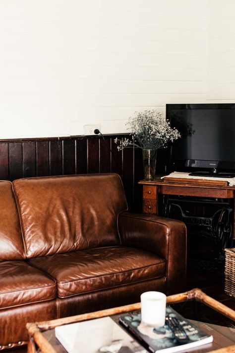 The classic dark brown leather sofa has served as a stereotypical focal point in the living room for decades. If not properly designed and utilized, l... | Don’t Forget Flowers #DarkBrownLeatherSofa #DarkBrownLeatherSofaDecorating #LeatherSofa #BrownLeatherSofa Deep Brown Sofa Living Room Ideas, Brown Leather Sofa Aesthetic, Small Living Room Brown Leather Sofa, Leather Couch Dark Wood Floors, Brown Leather Sofa Styling, Chestnut Leather Couch, Dark Brown Sofa Color Scheme, Dark Leather Couch Living Room, Dark Brown Leather Couch Living Room