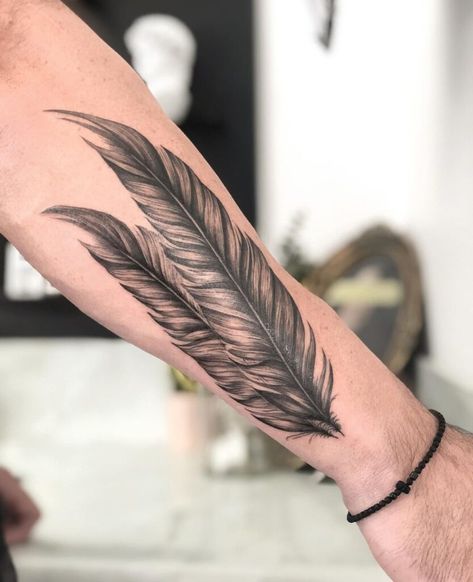 Spread Your Wings And Embrace Free Spirit With 25 Feather Tattoo Ideas Eagle Feather Tattoo Native American, Forearm Feather Tattoo, Feather Tattoo Sleeve, Pheasant Feather Tattoo, Raven Feather Tattoo, Birds Of A Feather Tattoo, Feather Tattoo Men, Eagle Feather Tattoo, Native American Feather Tattoo