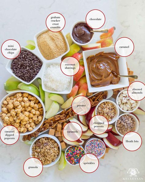 Sliced caramel apples and all the toppings for a fall caramel apple board Caramel Apples Topping Ideas, Apple Bar Ideas Fall, Sliced Caramel Apple Bar, Caramel Apple Slices Bar, Dipped Apple Bar, Caramel Apple Decorating, Apple Slice Caramel Apples, Carmel Apple Bar Diy, Caramel Apple Bar Crockpot