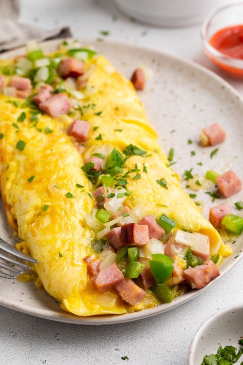 Denver Omelette from 40 Aprons | Loaded with ham, onions, peppers, and melted cheese, this recipe for a classic Denver omelette is a super easy, nutritious way to start your day off right. Eggs And Ham, Ham Omelette Recipes, Omlete Recipe Omelettes, How To Make An Omelette, Omelettes Recipe, Breakfast Omelette Ideas, Omelette Aesthetic, Denver Omelette Recipe, Protein Omelette