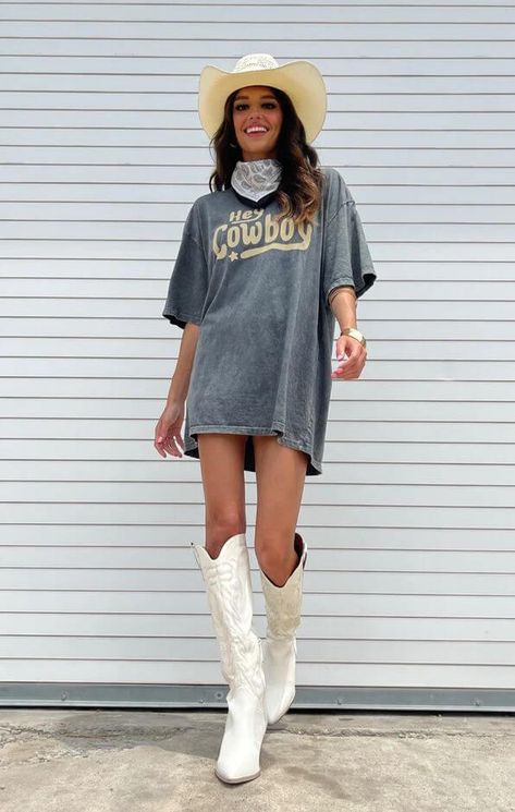 Chic Texas Rodeo Outfits for Women: Winter to Summer Style Guide Tshirt With Cowboy Boots Outfit, Country Concert Oversized Shirt Outfit, Country Tshirt Ideas Concert, Country T Shirt Dress Outfit, T Shirt Dress Outfit With Boots, Big Tshirt Cowboy Boots, Graphic Tee Cowboy Boots Outfit, T Shirt Cowboy Boots Outfit, Cowboy Boots Oversized Shirt