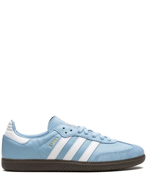 Samba Team "Argentina" sneakers from adidas featuring signature 3-Stripes logo, logo print to the side, round toe, front lace-up fastening, logo-print tongue, contrasting heel counter, gum-rubber sole and light blue/white. These styles are supplied by a premium sneaker marketplace. Stocking only the most sought-after footwear, they source and curate some of the most hard to find sneakers from around the world.. Argentina, Team Argentina, Light Blue Shoes, Pretty Shoes Sneakers, Shoe Inspo, Swag Shoes, Sneakers Blue, Adidas Samba Sneakers, Blue Sneakers