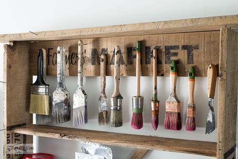 Hang up your paint brushes on finishing nails with this handy fence plank shelf that's super easy to make! Paintbrush Drying Rack, Paint Brush Organization Diy, Diy Hanging Paint Storage, Roll Up Paint Brush Holder Diy, Paint Brush Storage Rack, Ikea Storage Shelves, Branch Shelf, Craft Room Shelves, Paint Room