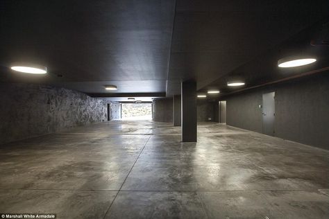 Industrial Garage, Built In Couch, Concrete Garage, Garage Design Interior, Charcoal Walls, Underground Garage, Luxury Garage, Modern Garage, Freestanding Fireplace