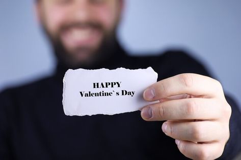 Happy valentine`s day a small white piec... | Premium Photo #Freepik #photo #hand-paper #holding-paper #paper-card #hold White Man Holding Letters, Hands Holding Cards, Holding A Piece Of Paper, Hand Holding Paper, Holding Paper, Brand Shoot, Male Hands, Piece Of Paper, Hand Holding