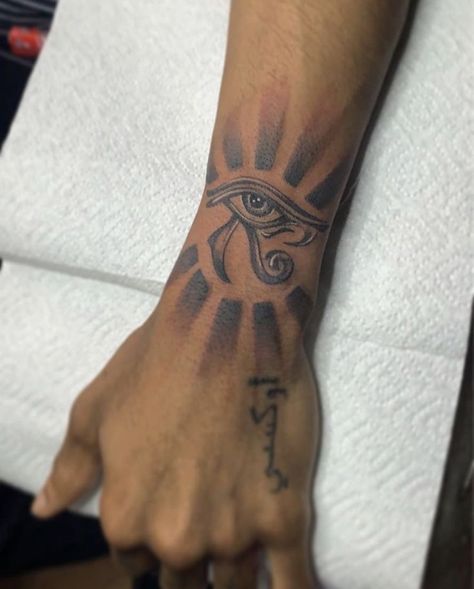 Forearm Wrist Tattoos Men, Men Tattoo Ideas Wrist, Wadjet Tattoo, Inside Of Bicep Tattoo For Men, Medium Hand Tattoos, Men's Arm Tattoo Ideas Design, Palm Size Tattoos Ideas Men, Men Wrist Tattoo Ideas, Mens Wrist Tattoos Ideas