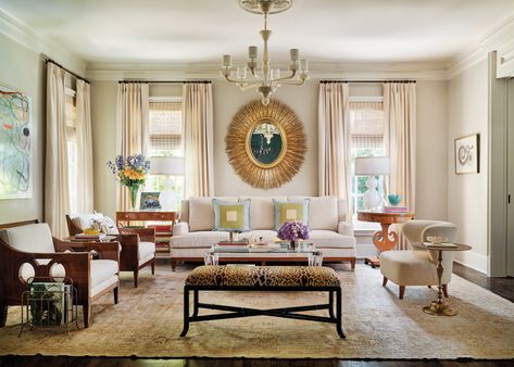 A large painting by Robert Jessup from Conduit Gallery overlooks the living room. An Elizabeth Chandelier, Delaney Sofa, Bradshaw Chairs, Charlotte Chair and Bamboo Bench, which wears a Scalamandré print, are all from the Jan Showers Collection. Jan Showers, Lucite Coffee Table, The Ritz Paris, Glamorous Living, Bespoke Chair, Painted Bookshelves, Dallas House, Dallas Interior Design, Ritz Paris