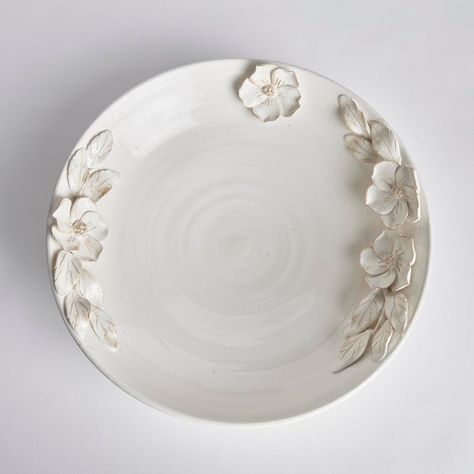 Each and every dogwood flower and leaf detail of the Fiori Decorative Grande Bowl is handmade, and hand-applied by Italian artisans in Tuscany, Italy. A seamless design in a soft white glaze and delicate antiquing along petal edges. With a classic Italian craftsmanship passed down through generations, each piece is a true original. In grand scale, a dynamic centerpiece for feature table, kitchen island or mantel.  Designer floor samples & new product from one of the hottest To The Trade & Retail Home Furnishings showrooms in the country. Located in Chicago's chic Roscoe Village, Kenneth Ludwig Chicago carries the industries best furniture & accessory brands. Always fresh, always inspiring. Quite often ( due to a discontinued style, fabric or frame ) they must sell off their showroom floor Dining Room Lighting Chandeliers, Table Kitchen Island, Dogwood Flower, Dogwood Flowers, Ceramic Color, Flower Bowl, Leather Pillow, Italian Craftsmanship, Pillow Texture