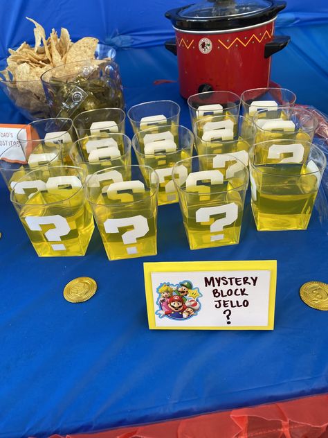 Mario Candy Ideas, Mario Kart Birthday Party Food Ideas, Goody Table Ideas, Super Mario Jello Ideas, Mario Snacks For Party, Nintendo Themed Snacks, Mario Treat Table, Mario Bros Snack Ideas, Nintendo Party Food