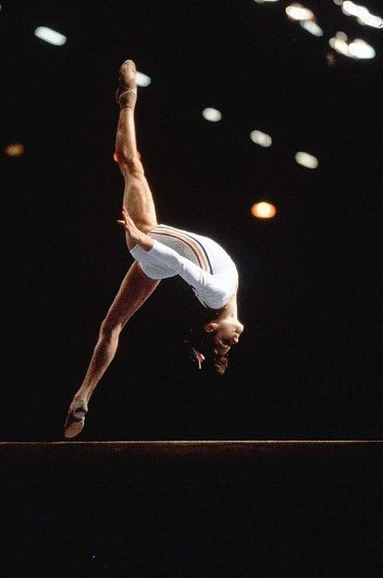 Nadia Comaneci - Perfect 10  "I don't run away from a challenge because I am afraid. Instead, I run toward it because the only way to escape fear is to trample it beneath your feet." -Nadia Comaneci, Nadia Comaneci Perfect 10, Thomas Carlyle, Nadia Comaneci, Gymnastics Photography, Gymnastics Pictures, Olympic Gymnastics, Balance Beam, Artistic Gymnastics, Female Gymnast