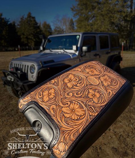 Tooled leather console Tooled Leather Car Interior, Western Leather Steering Wheel Cover, Leather Center Console Cover, Leather Console Cover, Tooled Leather Center Console Cover, Tooled Leather Steering Wheel Cover, Tooled Leather Console Cover, Western Jeep Accessories, Tooled Leather Projects