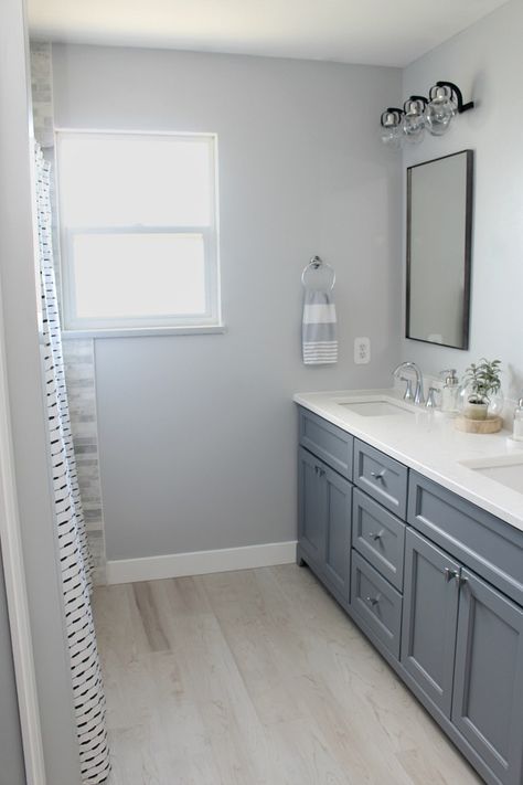 Beautiful coastal style bathroom design and decor ideas. #bathroomdecor #bathroomdesign #coastalstyle #greybathroom #doublevanity Gray Bathroom Tile Ideas Wall, Coastal Painting Ideas On Canvas, Colorful Small Bathroom Ideas, Modern Beach Bathroom Ideas, Coastal Chic Bathroom Ideas, Gray And Blue Bathroom Ideas, Bathroom Redo Ideas, Coastal Master Bath, Galley Bathroom