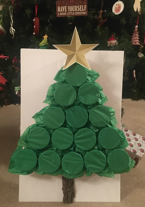 2 pieces of green tissue paper cover the red solo cups to create this tree.  Inside you can place whatever items you want - money, lottery tickets, candy, gift cards, lumps of coal, kids toys, etc.  For the game you can number and let each person pick a number to punch and that keeps the gifts close to the same amount or you can play high low card and whoever gets the highest card gets to punch a cup and keep what is in side.  This can be fun for children and adults of all ages. Christmas Tree Game, Shop Board, Christmas Gift Games, Xmas Games, Fun Christmas Party Games, Fun Christmas Games, Christmas Punch, Christmas Games For Family, Family Christmas Party