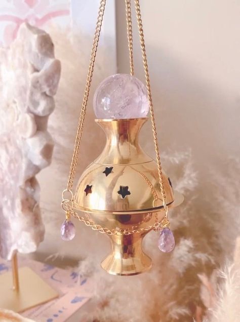 Immerse yourself in the mystique of this ethereal creation. Meticulously crafted with the divine touch of Amethyst crystal frequencies that grace this magical incense burner, radiating energies of protection, manifestation, and unwavering focus. Three high quality faceted Amethyst crystal beads and one Amethyst crystal sphere, accompany this celestial heirloom, enhancing its mystical charm. Measuring approximately 4 inches, each detail of our Amethyst Protection Incense Burner is a testament to Protection Incense, Protection Manifestation, Amethyst Protection, Instagram Sales, Salon Suites, Image Swag, High Vibrational, Jewelry Repair, Crystal Sphere