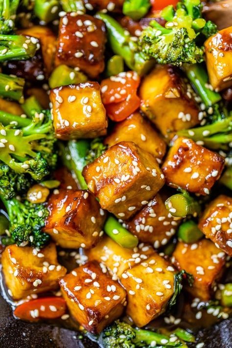 This quick and easy Sesame Soy Tofu Stir Fry is loaded with fresh and colorful vegetables and plant-based protein. #tofu #tofustirfry #plantbased #healthyrecipes #stirfry