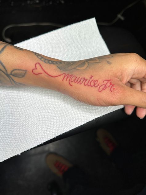 Red Tattoo Black Outline, Name Incorporated Tattoos, Name Tattoos In Red Ink, Name Tattoos Red Ink, Jada Tattoo Name, Red Name Tattoos For Women, Tat My Name On You So I Know Its Real, Name Tattoos Hand, Red Ink Name Tattoo