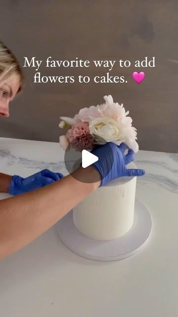 Kupcake Konnoisseur on Instagram: "A few months ago, I began incorporating flowers into my cakes using a new method, and I’ve absolutely fallen in love with it for several reasons.

✨ First, this approach allows the flowers to be preserved as a keepsake. Once the cake has been enjoyed, the entire arrangement of flowers can be effortlessly removed in one go, leaving you with a beautiful bouquet to cherish.

✨ Second, if you’ve ever spent time meticulously smoothing the sides of a cake, you know how disheartening it can be to pierce holes all over it just to add decorations. With this method, your cake stays perfectly smooth and pristine even after the flowers are removed, ensuring it looks stunning from start to finish.

✨ Lastly, this technique takes the guesswork out of flower placement. Cake With Flowers On Side, Arrangement Of Flowers, Wedding Cakes With Cupcakes, Fallen In Love, Wedding Cupcakes, Beautiful Bouquet, Flower Cake, Real Flowers, Over It