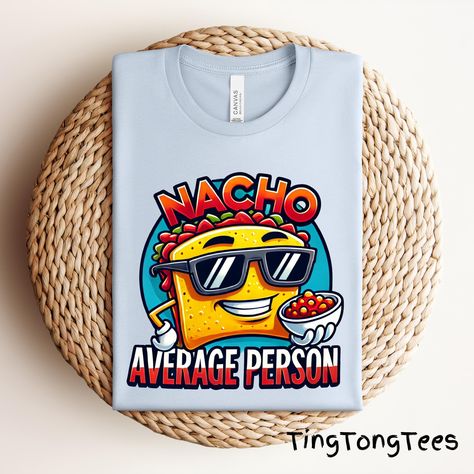 Spice up your wardrobe with this funny nacho shirt! Featuring a cool nacho chip with sunglasses and the pun "Nacho Average Person," this kawaii food tee is perfect for snack lovers, Mexican food fans, and anyone who loves a good pun. A great foodie gift! 📢 Please check all photos for details. 📢 How to Order: 1. Select your shirt size, and color from the drop-down menu. 2. Add any customization details via the "Add message to Seller" link at checkout. 3. If ordering multiple items, add each to your cart individually. 📢Shipping Info: - Located in Miami, Florida. Orders ship in 1-3 business days. - Delivery: 3-7 business days (varies by location). 📢Garment Features: - Soft and comfortable: Solid colors are 100% preshrunk cotton, Heather colors are 52% cotton/48% poly. - Sizing chart avail Nacho Chips, Food Pun, Best Puns, Food Puns, Average Person, Kawaii Food, Foodie Gifts, Miami Florida, Nachos