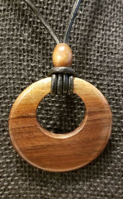 2 1/4" diameter black walnut pendant on adjustable black leather necklace. By the Woodchuck of Woodburn. Necklace Sliding Knot, Wooden Jewelery, Wood Jewelery, Driftwood Jewelry, Wood Resin Jewelry, Black Leather Necklace, Jewelry Knots, Wooden Necklace, Wood Accessories