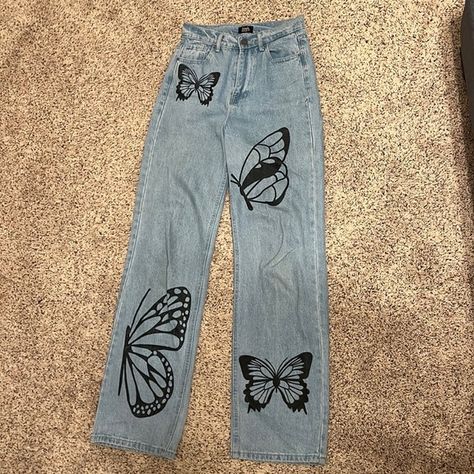 1/25, blue jean with butterfly pattern, simple society Jeans Painting Butterfly, Butterfly Painting On Jeans, Painting On Blue Jeans, Y2k Butterfly Jeans, Butterfly Painted Jeans, Fabric Painting On Jeans, Painting Clothes Ideas, Hand Painting Ideas, Painting On Jeans