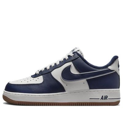 The Nike Air Force 1 '07 LV8 'College Pack Midnight Navy' is a classic silhouette with a modern twist. Featuring a white rear overlay with a chestnut-colored Swoosh, navy embroidery, and a double-knit pattern, this shoe is finished off with a fleece sock liner and a classic rubber sole. The sneaker is perfect for everyday wear, whether you're hitting the streets or the court. Inspired by the college lifestyle, this shoe is part of the College Pack series and is sure to turn heads. The iconic silver dubraes, color Nike Air branding, and navy nylon tongue complete the look. (AF1/SNKR/Skate/Men's/Light/Low Top/Non-Slip) Navy Blue Nike Shoes, Dark Blue Shoes, College Lifestyle, Nike Low Tops, Dream Shoe, Navy Embroidery, College Packing, Bday Gifts, Skate Man