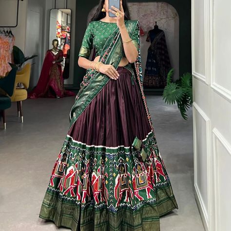 *🌷Lehenga Choli🌷* Elevate your ethnic wear collection with our Dola Silk Lehenga Choli, adorned with traditional Patola prints that exude sophistication and charm ❣️ *LNB1623BRN* *LNB1623GRN* *LNB1623NBL* *LNB1623PNK* *Lehenga(Stitched)* Lehenga Fabric : Dola Silk Lehenga Work : Patola Print and foil work Lehenga Waist : SUPPORTED UP TO 42 Lehenga Closer : Drawstring With Heavy Tassels and Zip Stitching : Stitched With Canvas and attached with Can Can Length : 41 Flair : 4.50 Meter Inne... Navy Blue Lehenga, Zip Stitching, Patola Print, Navratri Garba, Silk Lehenga Choli, Navratri Chaniya Choli, Stitched Lehenga, Work Lehenga, Blue Lehenga