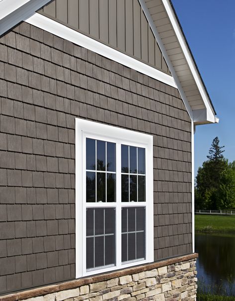 House exterior finished in ProVia Timberbay Cedar Shakes, Board n' Batten vinyl siding and stone veneer Bottom Brick Top Siding, Painted Brick And Vinyl Siding House Exterior, Clapboard And Shingle Siding, Board And Batten Cedar Shake, House With Shingles And Siding, Board And Batten With Cedar Shakes, Veneer Siding Exterior, Shakes On House Exterior, Cedar Shingles With Board And Batten