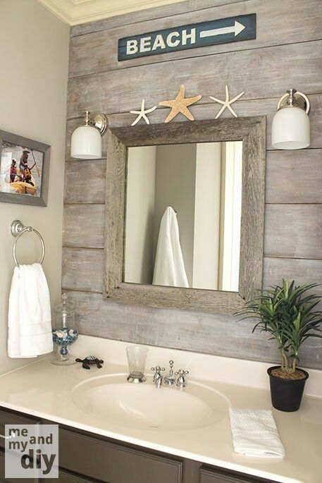 beach theme bathroom - love the "drift wood" behind the mirror Beachy Bathrooms, Makeover Kamar Mandi, Mermaid Bathroom Decor, Beachy Bathroom, Beach House Bathroom, Nautical Bathroom, Mermaid Bathroom, Nautical Bathroom Decor, Beach Theme Bathroom