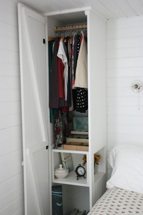 Here's a clever built-in from the folks at Assortment: a cabinet next to the bed that allows space for hanging clothe above,, storage below, and a nightstand in the middle, thanks to the little cut—out next to the bed. Bedroom Storage For Small Rooms, Closet Small Bedroom, Diy Bedroom Storage, Murphy Bed Ikea, Small Bedroom Storage, Tiny House Storage, Tiny Closet, Small Space Bedroom, Decor Studio