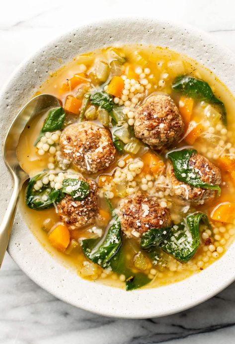 This Italian wedding soup recipe is a classic with homemade meatballs, pasta, and a delicious broth! It's straightforward to make and so comforting. Soup With Meatballs, Salt And Lavender, Italian Wedding Soup Recipe, Meatball Soup Recipes, Tender Meatballs, Wedding Soup, Meatball Soup, Meatball Ingredients, White Bowl