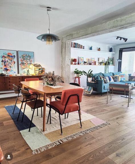 Living Dining Area Design, Open Floor Plan With Different Color Walls, Dining Table In Front Of Sliding Door, Dining Room Hang Out Area, Multiple Tables In Dining Room, Funky Retro Dining Room, Colorful Dining Room Rug, Pendant Above Dining Table, Light Wood Floor Decor