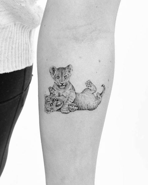 Cute lion cubs by @savv.ink Tattoo Map, Lioness And Cub Tattoo, Simple Lion Tattoo, Lion Cub Tattoo, Cub Tattoo, Female Lion Tattoo, Rare Tattoos, Cubs Tattoo, Lioness Tattoo