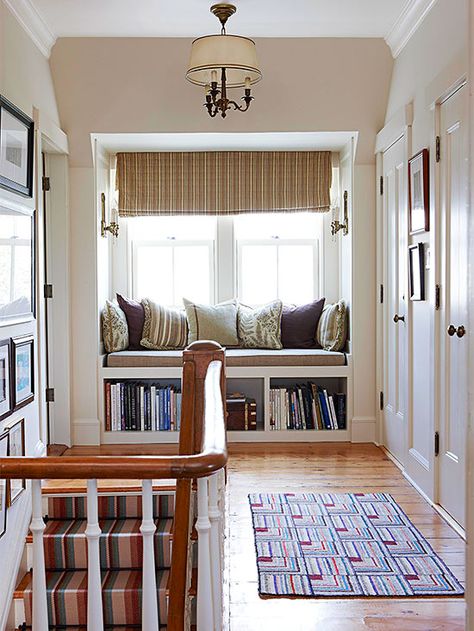 A cozy built-in bench makes for a perfect reading nook. See the rest of this coastal cottage: http://www.bhg.com/home-improvement/remodeling/before-and-after/a-coastal-cottage-renovation/?socsrc=bhgpin060213builtinnook=9 Library Seating, Built In Window Seat, Landing Ideas, Upstairs Landing, Window Seat Design, Window Nook, Cottage Renovation, Ideas Hogar, Coastal Living Rooms