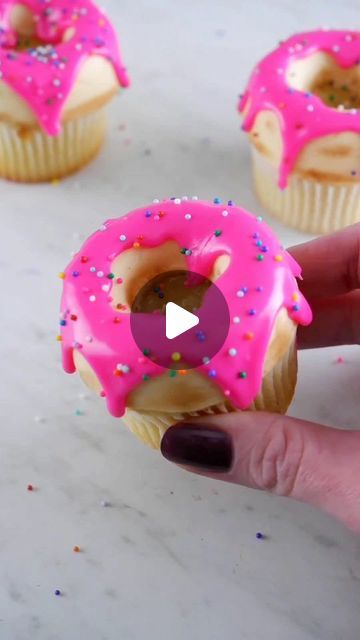 Coty Beth on Instagram: "Drippy iced donut cupcakes 🍩 I made the "donut" top with buttercream (freeze for ~15 manager placing cupcake on top), and dusted it with cocoa powder. Pink icing is ganache! #cupcakes #cupcakedecorating #donuts #cakehacks #cupcake" Donut Ideas For Birthday, Cupcake Donut Theme, Donut Cupcake Cake, Donut Themed Cupcakes, Donut Theme Cupcakes, Donut Cupcakes Ideas, Two Sweet Cupcakes, Ganache Cupcakes, Bakery Decoration