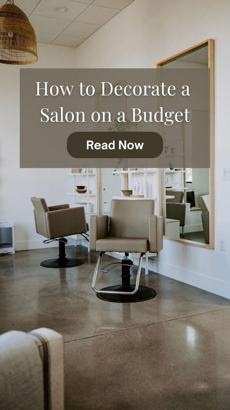 A salon space with two dark-beige styling chairs in front of two large mirrors.