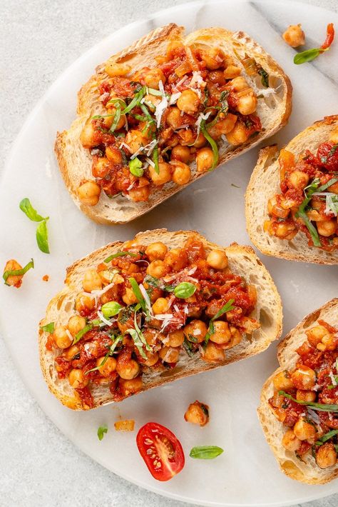 Whether you're making breakfast, lunch, or dinner, these spiced chickpea and tomatoes make for the perfect anytime meal. It's packed with flavor from the dried spices and fresh basil, and it pairs perfectly with toasted crusty bread. #chickpea #veganbreakfast #chickpeatoast #veganprotein #chickpeatomato #sweetsimplevegan #breakfast #30minute Chickpea Tomato, Tomato Toast, Dried Spices, Lazy Cat Kitchen, Making Breakfast, Spiced Chickpeas, Vegan Parmesan Cheese, Vital Wheat Gluten, Vegan Mexican