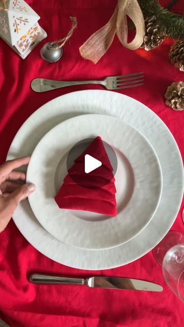 Manuela Mazzocco on Instagram: "✨Christmas Tree Napkin Fold✨ One more way to showcase the magic of the season❤️ This simple yet enchanting fold can add a sprinkle of joy to your holiday celebrations😘 Merry Christmas 🎄  #napkinfold #tutorial #howto #napkin #tabledecor #holidaytable" How To Fold A Cloth Napkin Like A Christmas Tree, Napkin Folded Like Christmas Tree, Napkin Christmas Tree Folding, Ways To Fold Paper Napkins For Christmas, Folding A Napkin Like A Christmas Tree, Christmas Tree Napkin Folding Tutorials, Christmas Party Table Settings Ideas, Fold Napkin Like Christmas Tree, How To Fold A Christmas Napkin