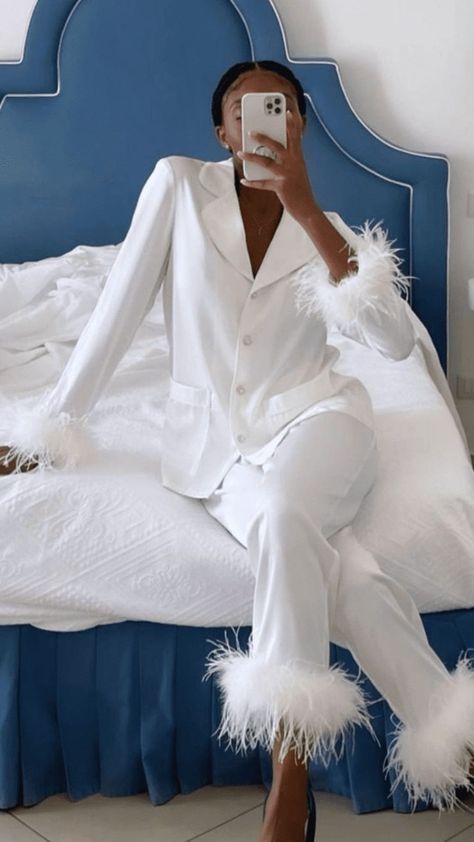 If you’re looking for a fun and comfortable fit to sport while getting glam with your bridesmaids, these feather pajamas will not disappoint! The lightweight silk fabric will keep you warm and cozy while the luxe feather trim will make the perfect wedding photo op. You can also wear them on your wedding night and long after the wedding is over! Find more wedding trends you'll love at the link. // Photo: Remonia Bride Pajama, Ready Outfits, Nadine Merabi, Satin Pyjamas, Pijamas Women, Bridal Pajamas, Inspiration Pics, Full Sleeve Blouse, White Pajamas