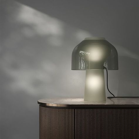 Karman Italia on Instagram: "LILLY_ designer @giorgiosilla | News 2024 It starts with three basic versions, where the sinuously elegant table lamp designed by Giorgio Silla, although in the same curvilinear shape and with the same fragile, ethereal material, has aesthetics that are so different as to give it three different personalities: a transparent voile in blown glass, formed to show the double light fitting inside the base and shade, the total look of frosted white glass that makes it difficult to tell the difference between the base and shade, and a two-tone piece in smoked glass for the body of the lamp, and transparent glass for the diffuser. . . . #karmanrepublic #breakthesilence #madeinitaly #lighting #lightingdesign #projects #lamps #design #decor #light #architects #home #inte Karman Lighting, Lamps Design, Different Personalities, Elegant Table Lamp, Table Lamp Design, Total Look, Design Decor, Elegant Table, Light Fittings