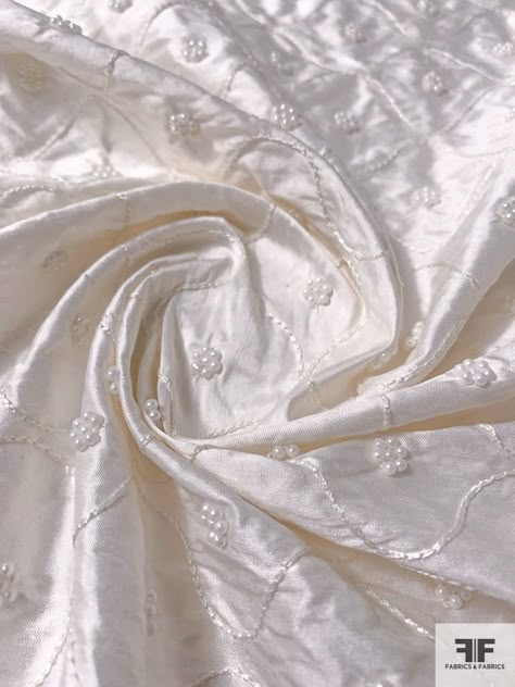 For an amazing classic white bridal fabric, look at this silk white silk shantung designer fashion fabric with wavy line embroidery and pearl beads. SKU: 12284 Content: 100% Silk Color: Silk White Width: 43 inches Patterned Silk Fabric, White Silk Fabric Texture, White Patterned Fabric, Luxury Embroidered Cream Tulle Fabric, Luxury Elegant Art Silk Fabric, Silk Dress Embroidery, Luxury White Embroidered Art Silk Fabric, White Fabric Aesthetic, Silk Texture Fabric