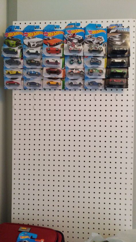 Creative and cheap DIY solution for a hot wheels display. Pegboard and dollar store zip ties. Expand as much as needed and hang anywhere you want. #hotwheels Hot Wheels Car Storage Ideas, How To Display Hot Wheels, Hot Wheels Display Diy, Hot Wheel Car Display Ideas Diy, How To Display Hot Wheels In Package, Hotwheel Display Idea, Hot Wheels Display In Package, Hot Wheel Organizer, Hot Wheels Organization Ideas