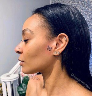 Butterfly on side of face Side Burn Tattoos For Women Face, Side Burn Tattoos For Women, Butterfly On Face, Butterfly Face Tattoo, Small Face Tattoos, Clavicle Tattoo, Face Tats, Side Of Face, Face Tattoos For Women