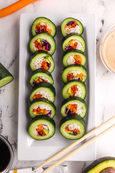 This easy version of veggie sushi is fun to make and doesn't require any nori rolls or seaweed! A spicy mayo sauce is a delicious topper or dipper, or you can use the traditional soy sauce or tamari sauce. The crunch of the cucumber and the versatility of the fillings make this a recipe the whole family can enjoy! Spicy Mayo Sauce, Nori Rolls, Yeast Rolls Recipe, Cucumber Sushi, Sushi Ingredients, Rice Maker, Hot Pot Recipe, Veggie Sushi, Lunch Meals