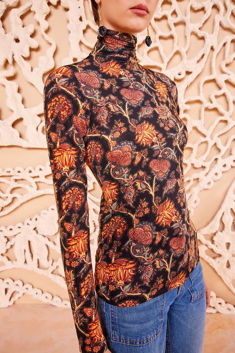 Our Aurelia Turtleneck in lightweight tricot jersey is a forever favorite silhouette, printed in a mesmeric blend of paisley botanicals inspired by vintage French florals. Blooming with orange and red hues against classic black, this long-sleeve top has a close fit that makes it perfect for layering or wearing on its own, while the high neck adds a touch of elegance. Composition: 91% Rayon, 9% Elastane Nyc Boutiques, Brown Long Sleeve, Long Sleeve Floral Top, Knit Denim, Turtleneck Top, Denim Accessories, Knitted Coat, Dress Gift, Turtle Neck Top