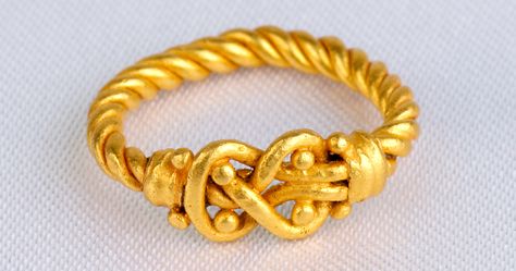 The Hercules Knot Ring. Ꜹ, 3.8 g, circa 1st century AD. This beautifully intricate ring is called a knot of Hercules or marriage knot. It is a strong knot created by two intertwined ropes of gold. It originated as a healing charm in ancient Egypt, however is it best known from Greece and Rome as a protective amulet, most notably as a wedding symbol. Extremely fine. Measures: 1.5 ring size. $750. Heracles Knot Ring, Hercules Knot Ring, Heracles Knot, Hercules Knot, Protective Amulet, Reef Knot, Byzantine Gold, Wedding Symbols, Strong Knots