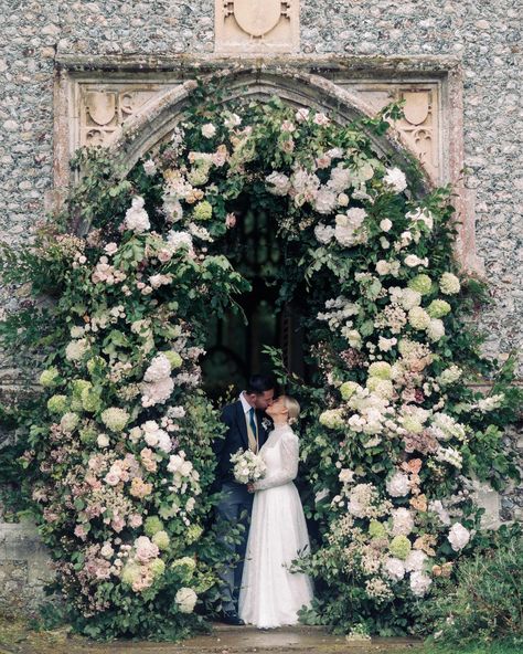 Breathtaking blush pink Floral Arch for a private estate wedding in Norfolk | Attabara Studio | This glorious 4m floral arch was filled with an abundance of garden roses, paniculata hydrangeas and daisies in a palette of soft pinks, warm blushes & trailing foliages for a beautiful marquee wedding in the Norfolk countryside | Wedding Planning & Design by Attabara Studio Pink Floral Arch, Pink Church, Wedding Floral Arch, Summer Wedding Ceremony, Church Wedding Flowers, Lush Wedding, Green Wedding Flowers, Floral Arch Wedding, English Garden Wedding