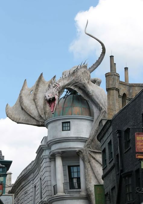 I'll know I've made it when I'm applying for planning permission to put a dragon on my roof. What about you? Here There Be Dragons, Unusual Buildings, Images Harry Potter, Dragon Sculpture, Universal Studios Florida, Image Swag, Here Be Dragons, Diagon Alley, Dragon Statue