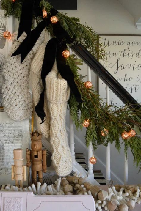 Christmas Black Decor Ideas, Christmas Decor With Velvet Ribbon, Small Staircase Christmas Decor, Boho Garland Christmas, Stockings On Stairs With Garland, Black And Copper Christmas Decor, Christmas Decor Velvet Ribbon, Garland And Stockings On Staircase, Neutral And Black Christmas Decor